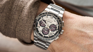 Best Solar Watches: Seiko Astron solar GPS watch with silver dial, black bezel and multiple subdials on a stainless steel bracelet