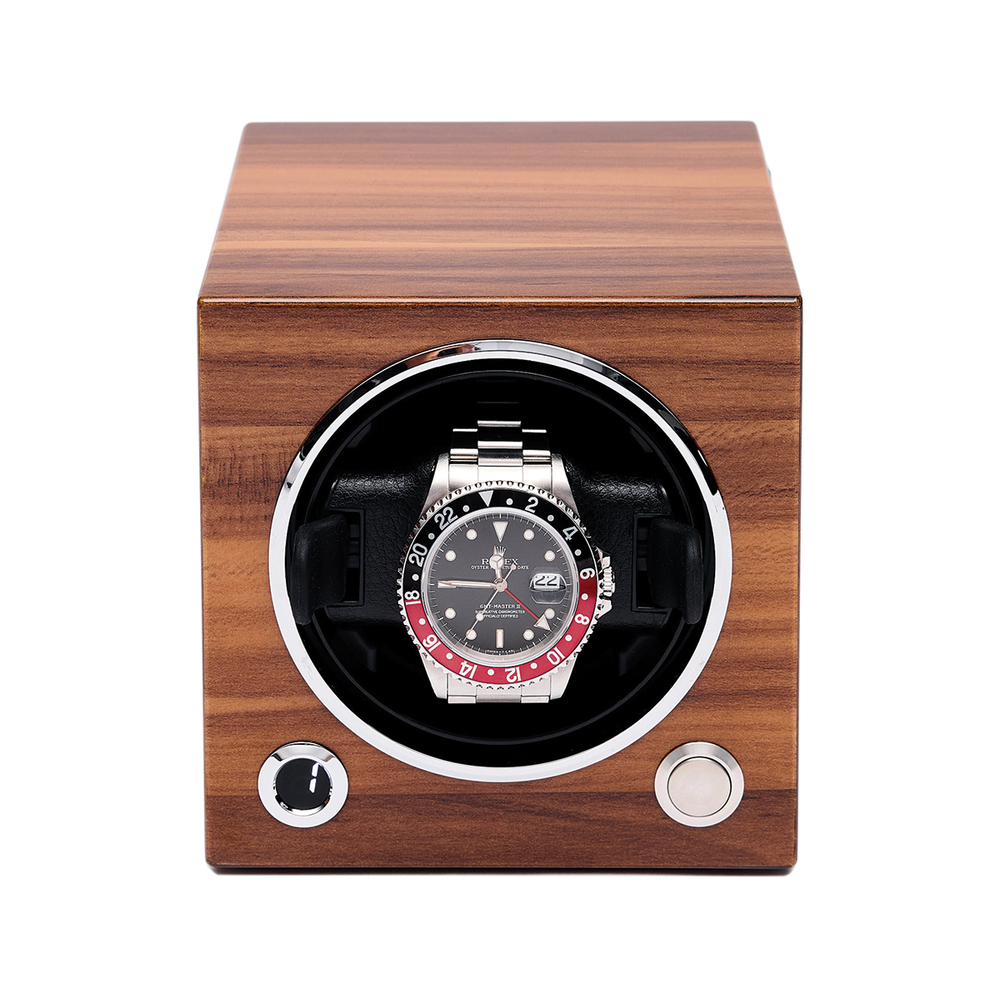 Front view of a wooden single watch winder with round opening and a stainless steel watch inside.