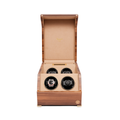 Perpetua Four Watch Winder in wood with lid open revealing four slots and a watch in the bottom-left slot