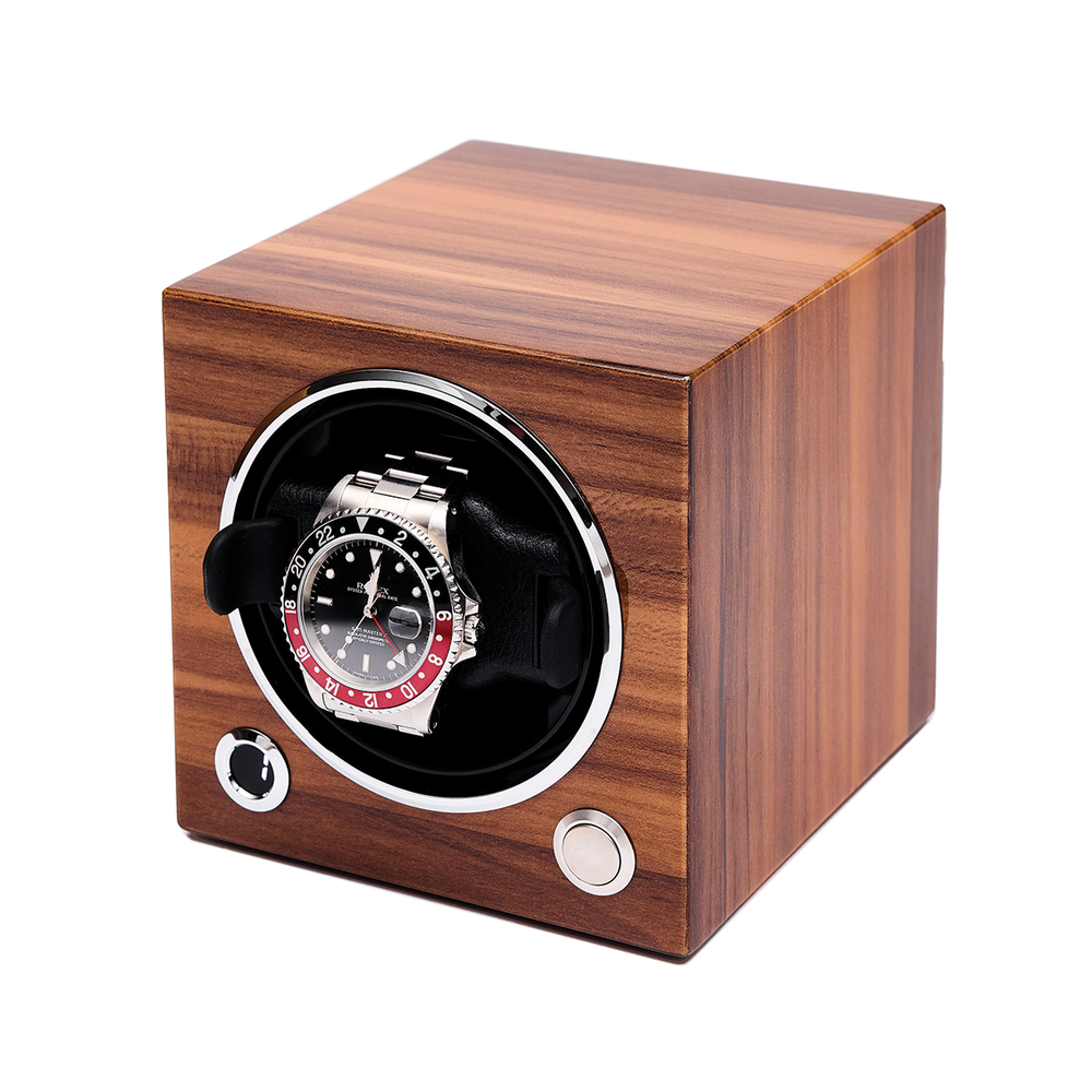 Angled side view of a wooden single watch winder with a circular front opening housing a stainless steel watch.