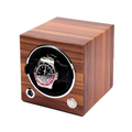 Angled side view of a wooden single watch winder with a circular front opening housing a stainless steel watch.