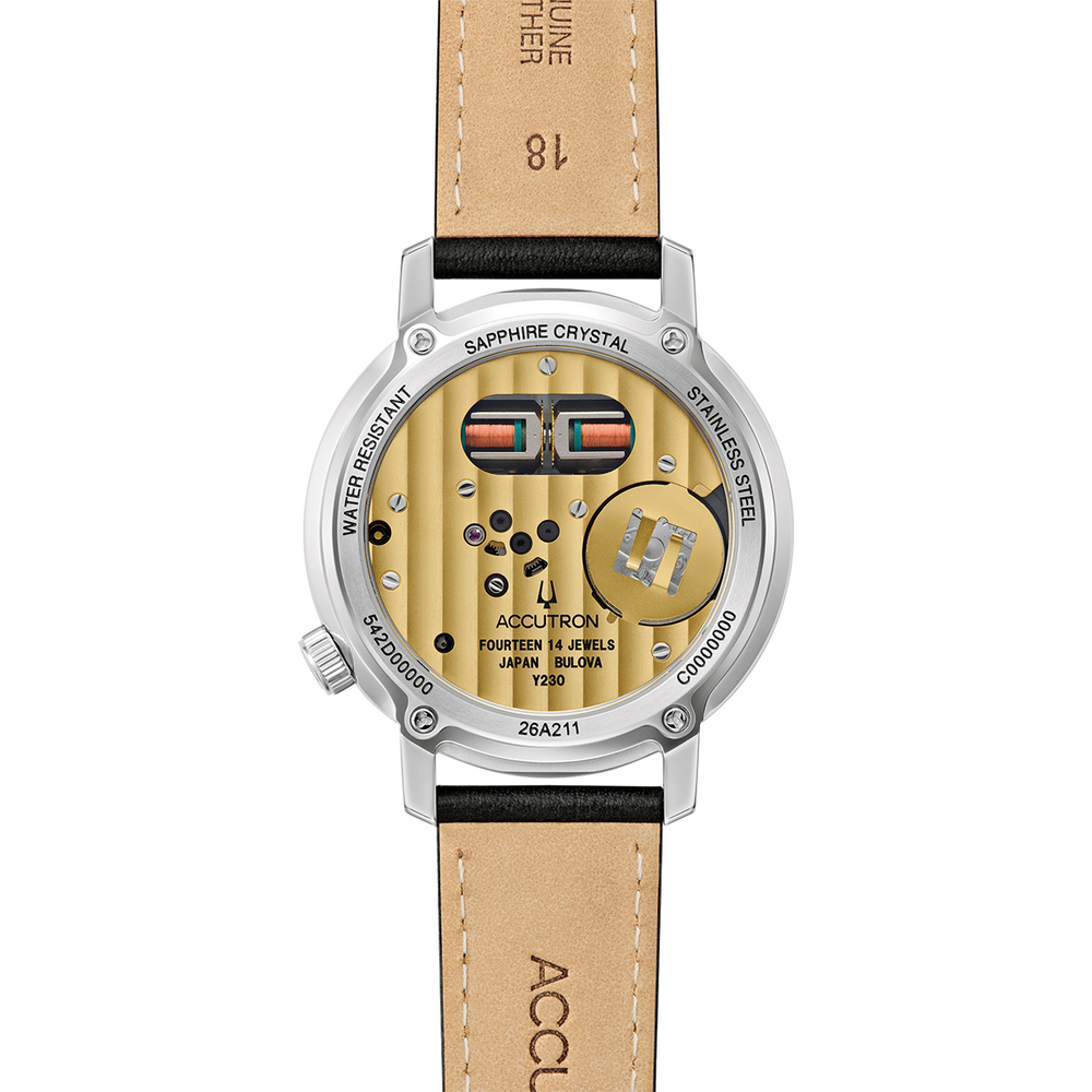 Back view of a silver spacewatch with exposed movement through sapphire crystal and a tan stitched leather strap.