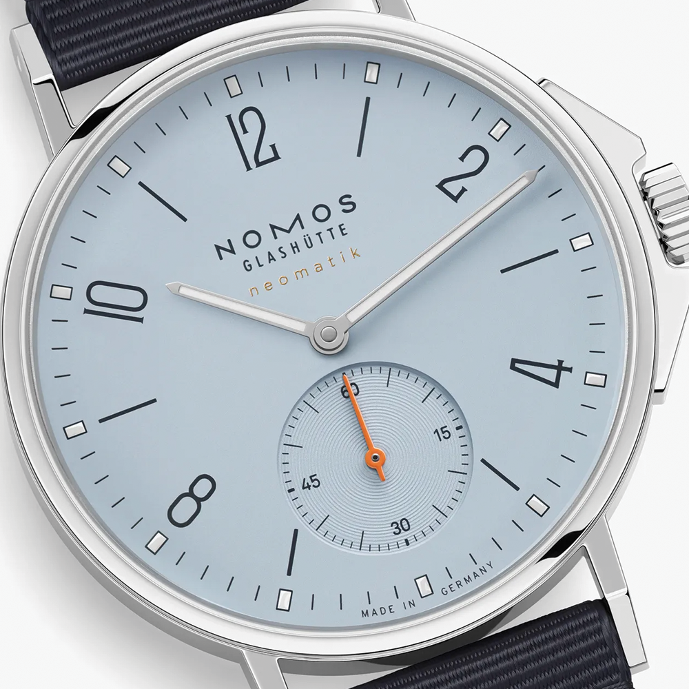 Close-up of Ahoi Neomatik Sky dial in light blue with bold numerals small seconds subdial and orange hand