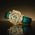 Spaceview Evolution champagne gold skeleton watch on green leather strap against a dark gradient background with reflection.