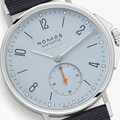 Close-up of the light blue dial with orange seconds hand and subdial on Nomos Ahoi Neomatik Sky 36mm.