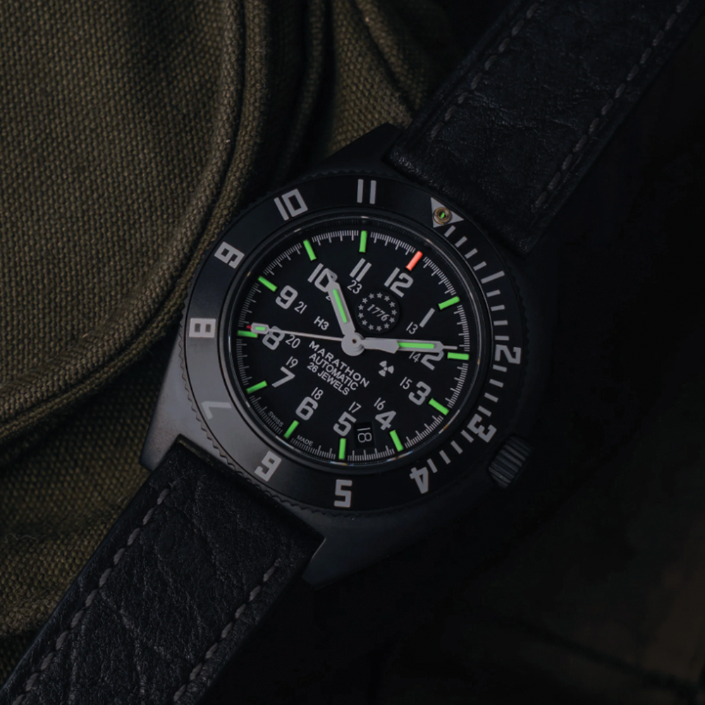 Close view of SSNAV-D Auto U.S. 250 Limited Edition 41mm black dial watch with green lume on rubber strap