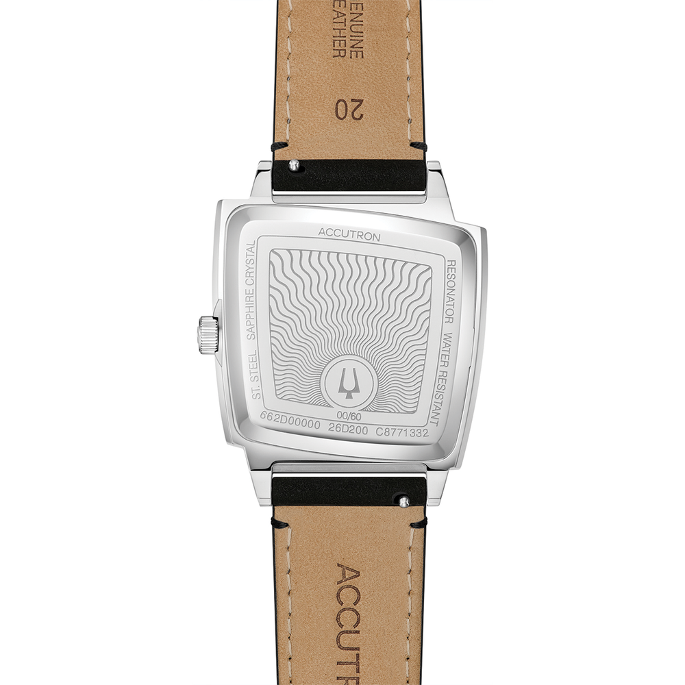 Memphis 521 silver-tone watch back on tan leather strap with engraved case details