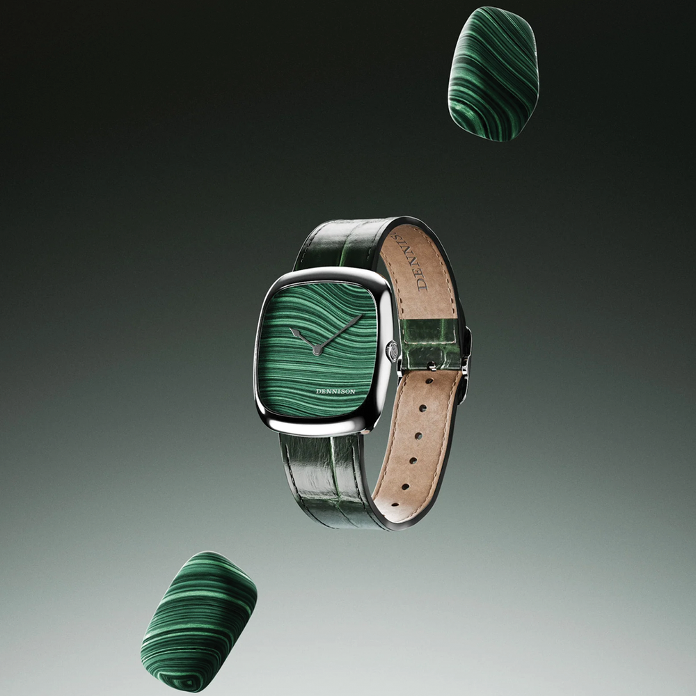 Steel cased malachite dial watch with green leather strap in a floating promotional composition