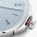 Close-up of the side of Ahoi Neomatik Sky showing a knurled crown with red gasket and polished steel case