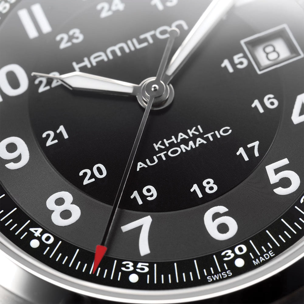 Close up of Hamilton Khaki Field Auto 42mm dial with black face white numerals and date window