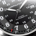 Close up of Hamilton Khaki Field Auto 42mm dial with black face white numerals and date window