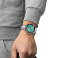 Wrist shot of Tissot Seastar 1000 Quartz turquoise dial watch on stainless steel bracelet