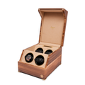 Perpetua Four Watch Winder in wood with four slots and an open lid showing tan interior and a watch in the front left slot