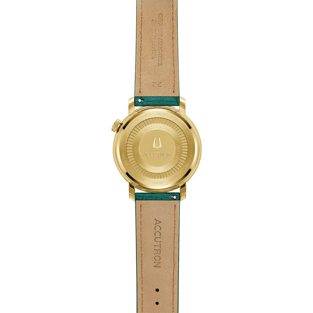 Back view of Spaceview Evolution watch showing engraved gold case back and green leather strap.