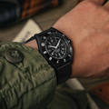 Wrist shot of SSNAV-D Auto U.S. 250 Limited Edition 41mm black dial on black rubber strap with green lume