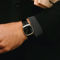 ALD Time Only Sunray Black steel 37mm watch with black leather strap displayed against a dark background