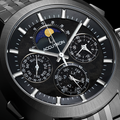 Close up of Horizon 41.5mm black dial with moon phase and intricate subdials on a brushed stainless steel case