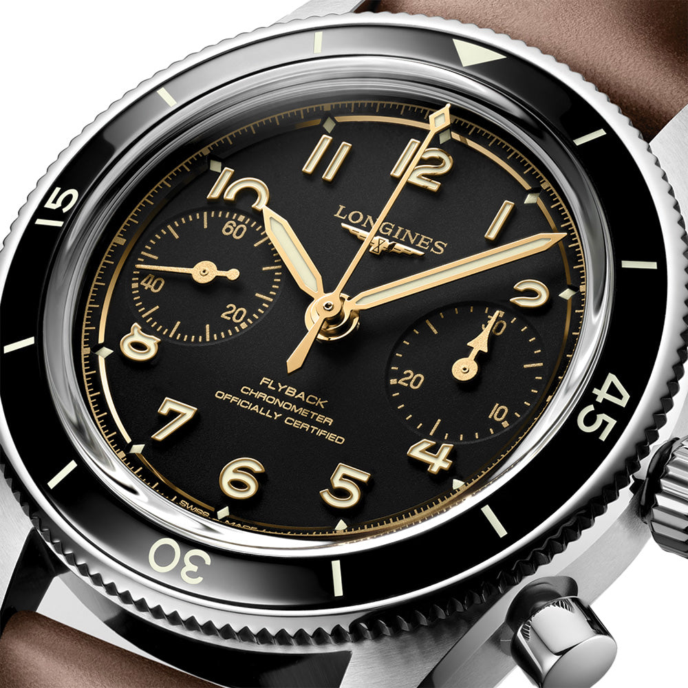 Close-up of Longines Spirit Pilot Flyback dial with gold hands and numerals and two subdials.