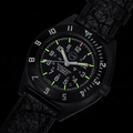 Close-up of SSNAV-D Auto U.S. 250 bezel and dial with green luminescent markers on a black rubber strap