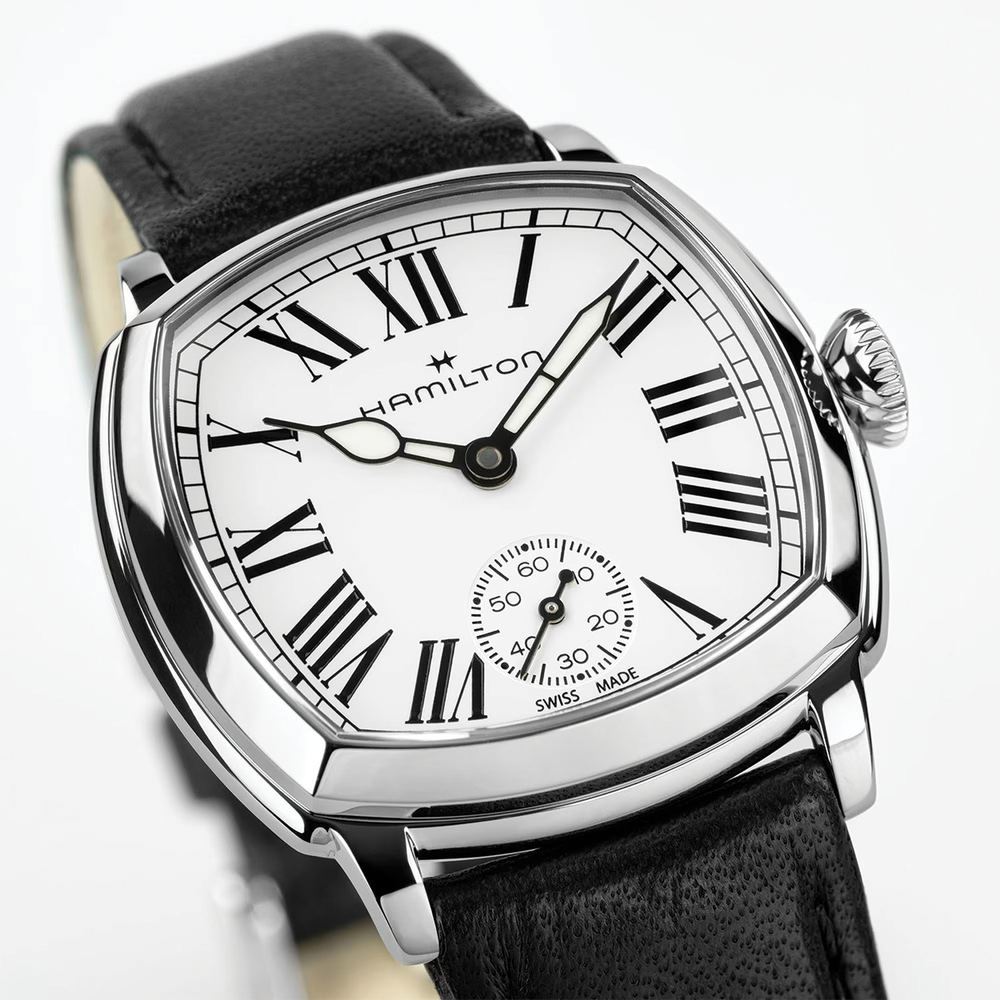 Angled view of Hamilton cushion watch showing white dial with Roman numerals and subdial on black leather strap