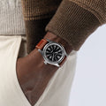 Khaki Field Auto 42mm wristwatch on brown leather strap worn on the wrist