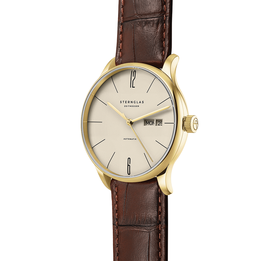 Berlin Automatic gold 38mm watch with sepia dial and brown leather strap shown from the side
