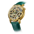 Angled view of Spaceview Evolution champagne gold skeleton watch with an intricate dial and green leather strap.
