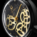 Close-up of Spaceview Evolution 43.5mm skeleton watch with gold gears on a black leather strap