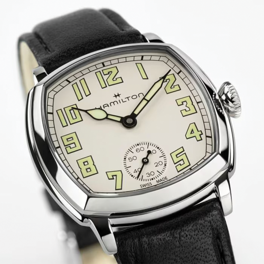 Beige dial with luminous numerals on the American Classic Cushion Mechanical watch on a black leather strap