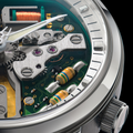 Macro view of the Spaceview 314 movement edge with gears green circuit board and striped resistors