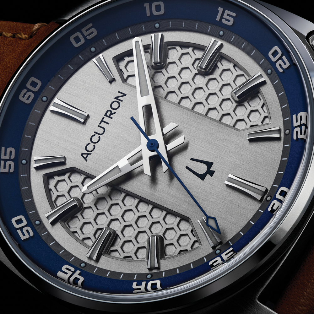 Close up of Elevation 39mm grey dial with honeycomb texture silver markers and blue second hand