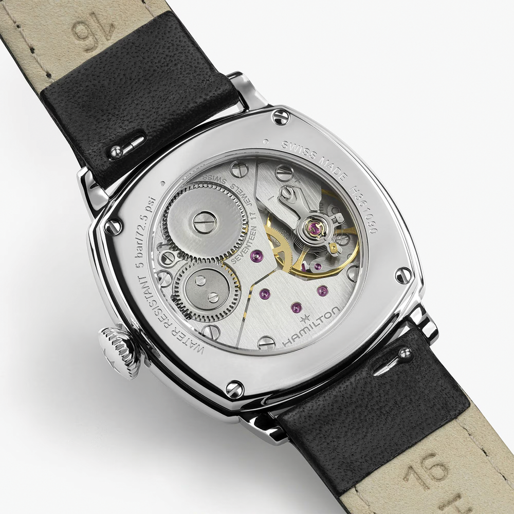 Back view of American Classic Cushion Mechanical 30mm watch with a leather strap and visible movement through the caseback.