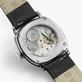 Back view of American Classic Cushion Mechanical 30mm watch with a leather strap and visible movement through the caseback.