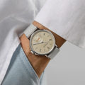 On wrist Nomos Ahoi Neomatik Sand beige dial watch with light gray fabric strap