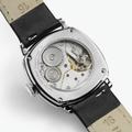 Back view of Hamilton American Classic Cushion Mechanical 30mm watch with a beige leather strap and visible movement.