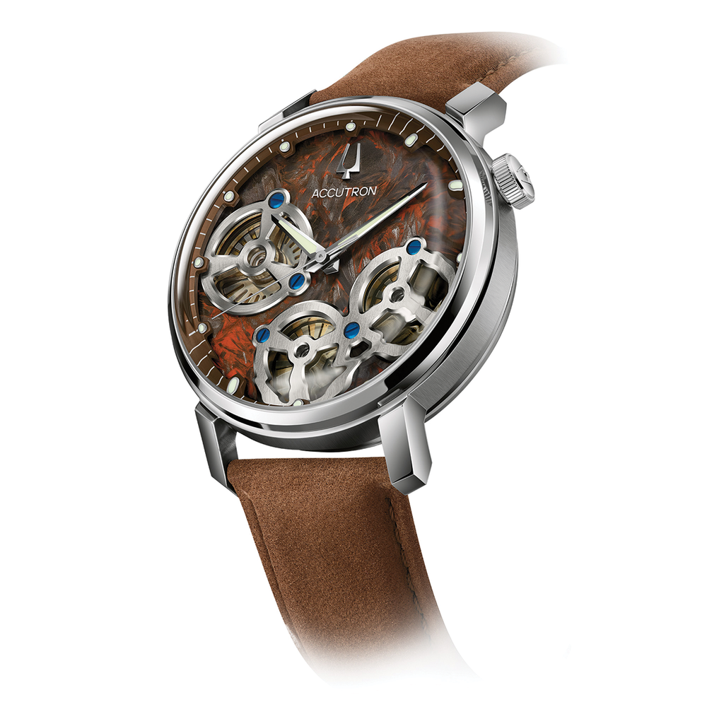 Close up of Spaceview Evolution 43.5mm showing the skeleton dial with brown strap and blue screw accents.