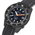Close up of blue dial with luminous markers, white hour hand and orange minute hand, date window