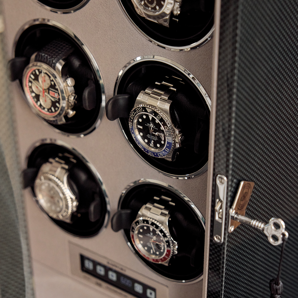 Close up of the black Formula Six watch winder interior showing six watches in round holders