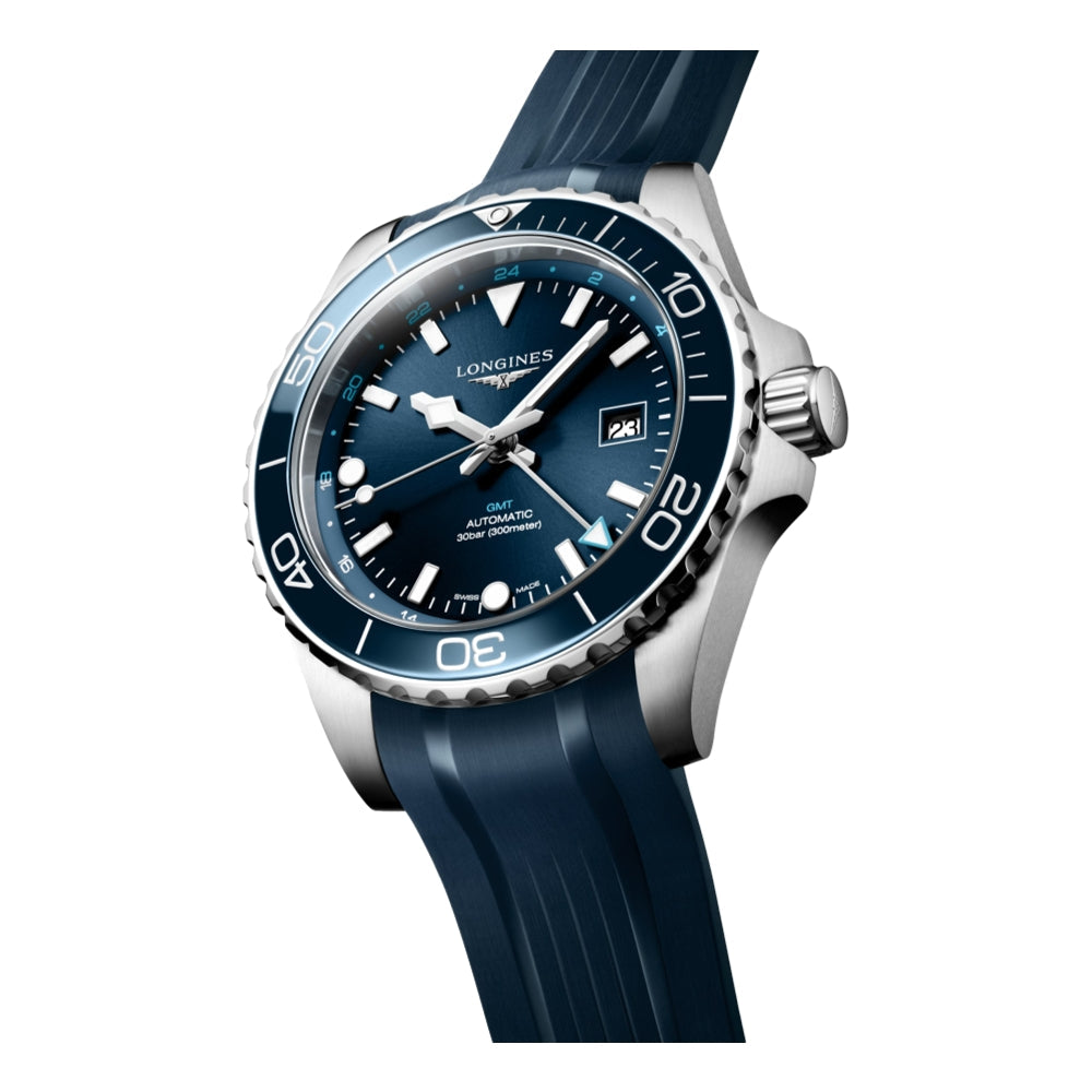 Angled Longines HydroConquest GMT blue dial watch with blue bezel on blue rubber strap