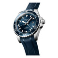 Angled Longines HydroConquest GMT blue dial watch with blue bezel on blue rubber strap