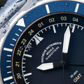 Close-up of Seebataillon GMT dial with gold 24-hour numerals and white hands.